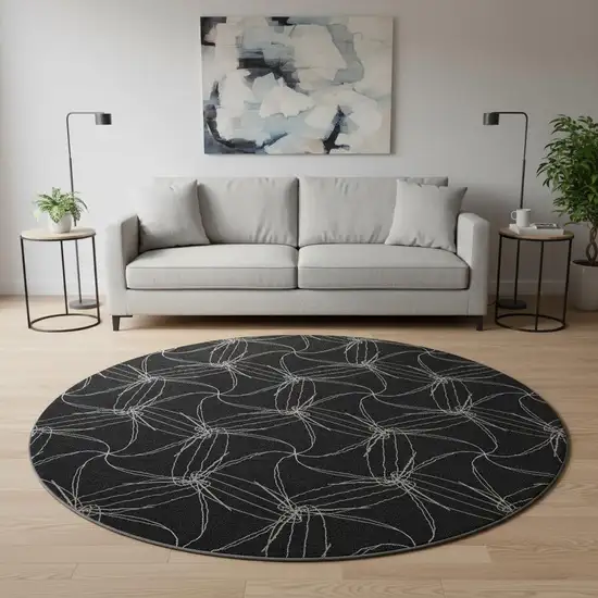 8' Black And Ivory Geometric Washable Round Rug With UV Protection Photo 1