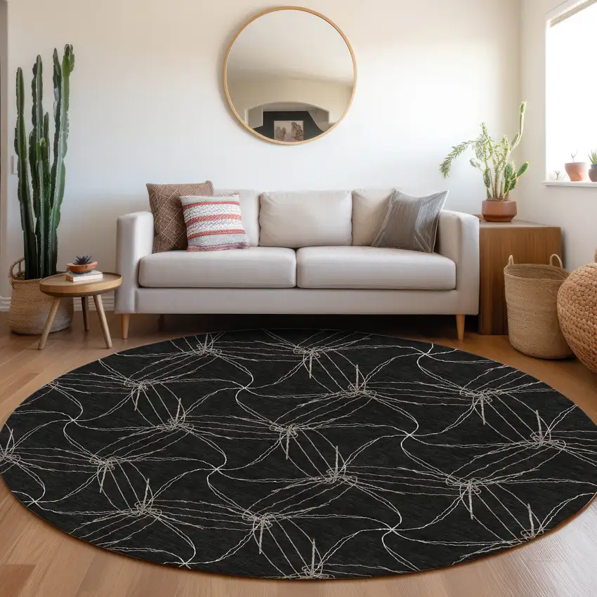 8' Black And Ivory Geometric Washable Round Rug With UV Protection Photo 4