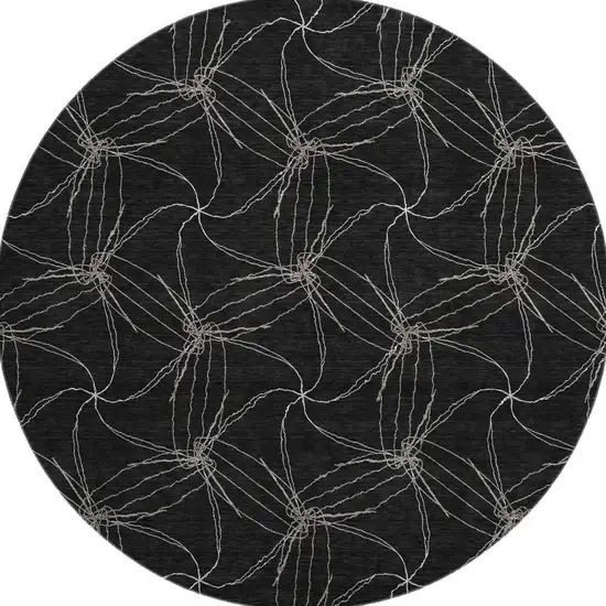 8' Black And Ivory Geometric Washable Round Rug With UV Protection Photo 2