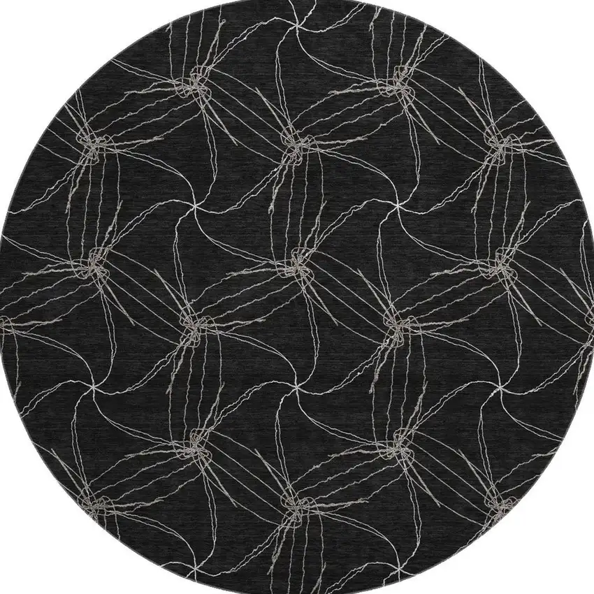 8' Black And Ivory Geometric Washable Round Rug With UV Protection Photo 2