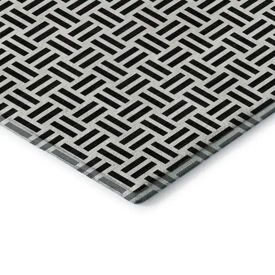 8' Black And Ivory Geometric Washable Round Rug With UV Protection Photo 6