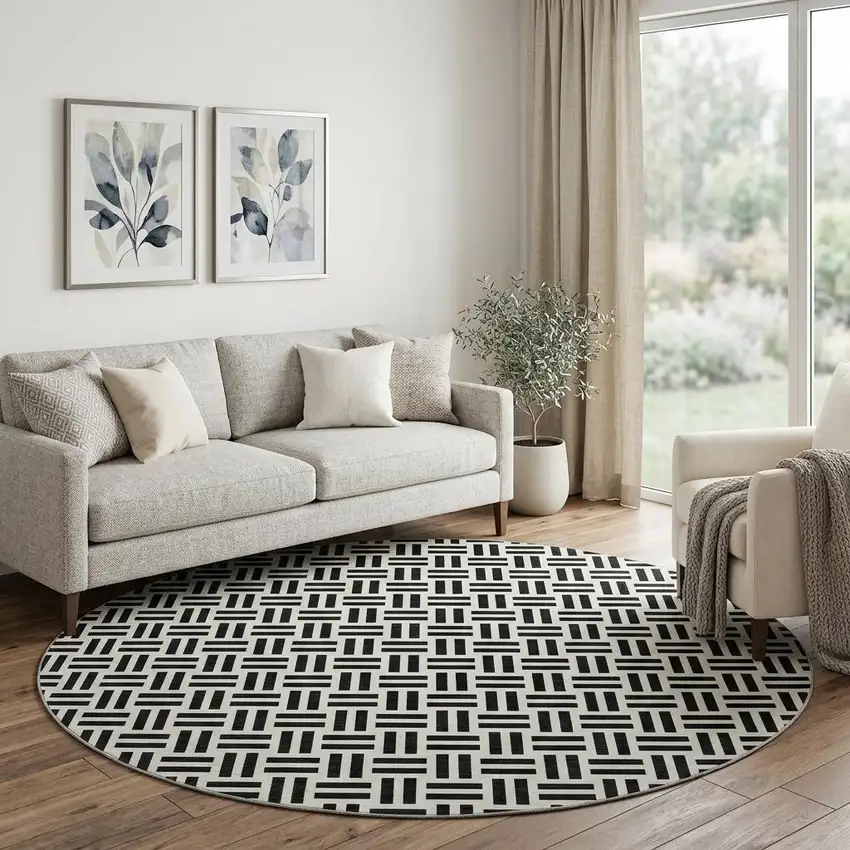 8' Black And Ivory Geometric Washable Round Rug With UV Protection Photo 1