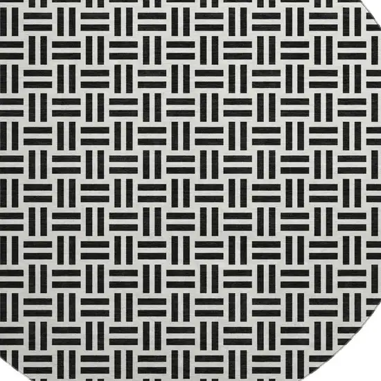 8' Black And Ivory Geometric Washable Round Rug With UV Protection Photo 2