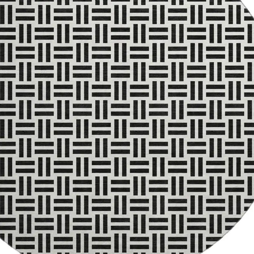 8' Black And Ivory Geometric Washable Round Rug With UV Protection Photo 2