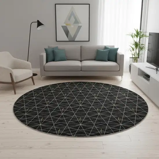 8' Black And Ivory Geometric Washable Round Rug With UV Protection Photo 2