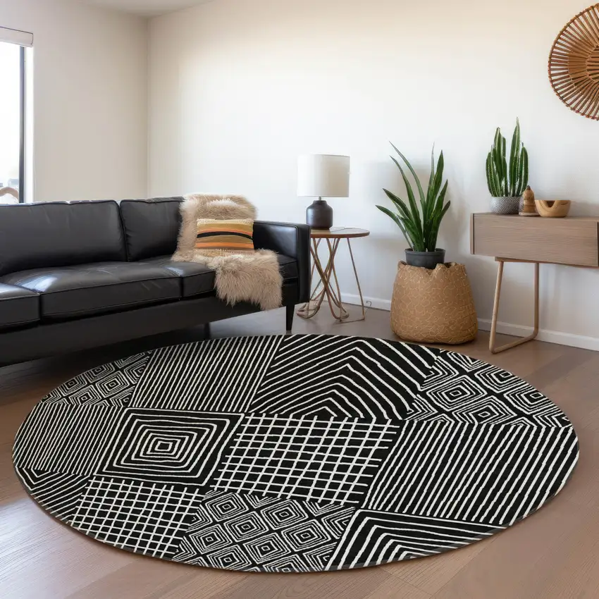 8' Black And Ivory Geometric Washable Round Rug With UV Protection Photo 4