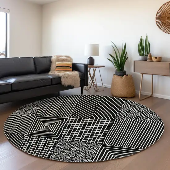 8' Black And Ivory Geometric Washable Round Rug With UV Protection Photo 4