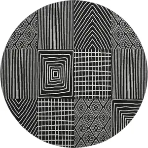 Photo of 8' Black And Ivory Geometric Washable Round Rug With UV Protection