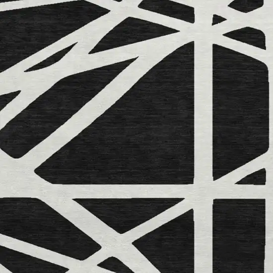 8' Black And Ivory Geometric Washable Round Rug With UV Protection Photo 2