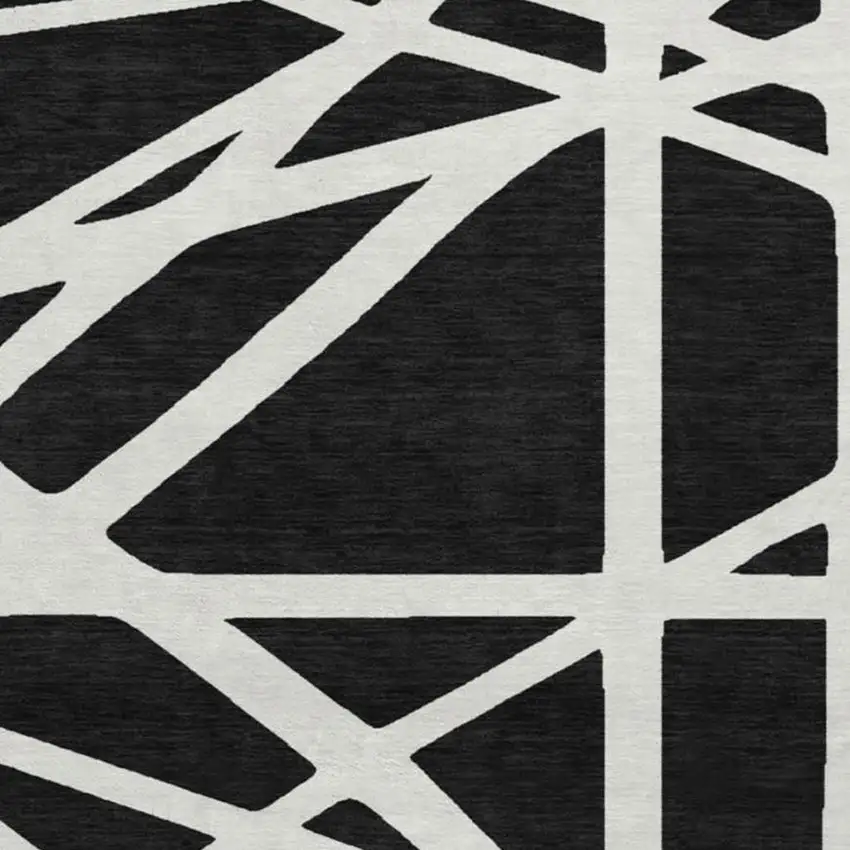 8' Black And Ivory Geometric Washable Round Rug With UV Protection Photo 2