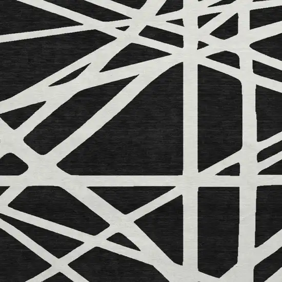 8' Black And Ivory Geometric Washable Round Rug With UV Protection Photo 3