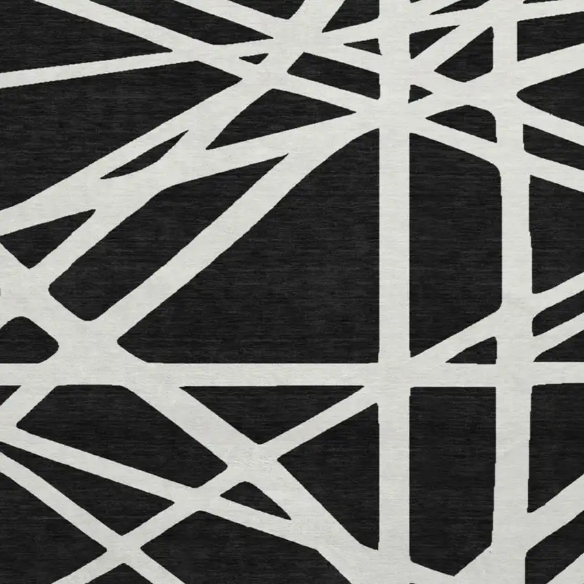 8' Black And Ivory Geometric Washable Round Rug With UV Protection Photo 3