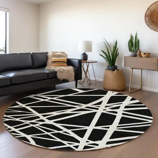 8' Black And Ivory Geometric Washable Round Rug With UV Protection Photo 4