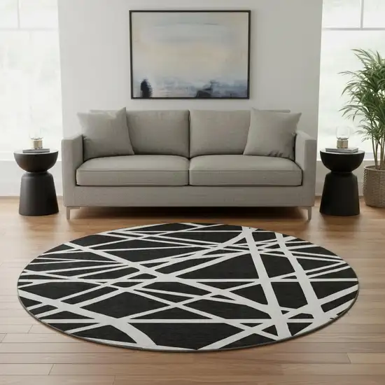 8' Black And Ivory Geometric Washable Round Rug With UV Protection Photo 2
