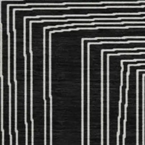 8' Black And Ivory Geometric Washable Round Rug With UV Protection Photo 2