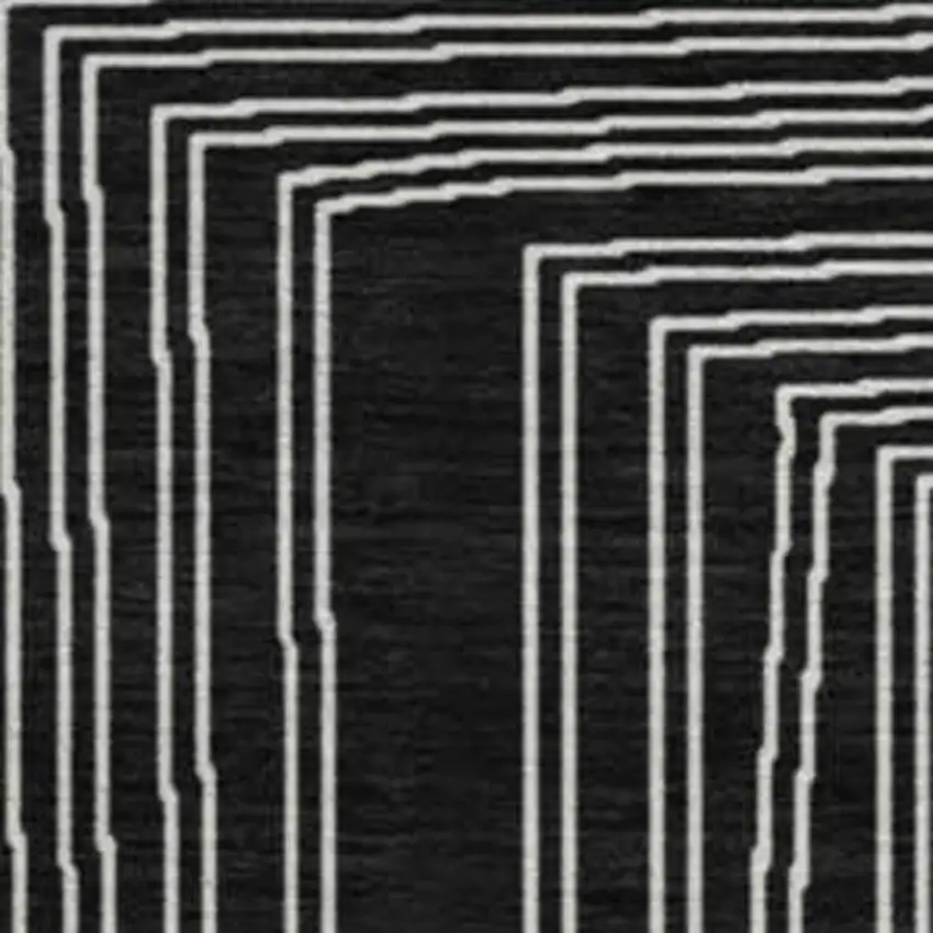 8' Black And Ivory Geometric Washable Round Rug With UV Protection Photo 2