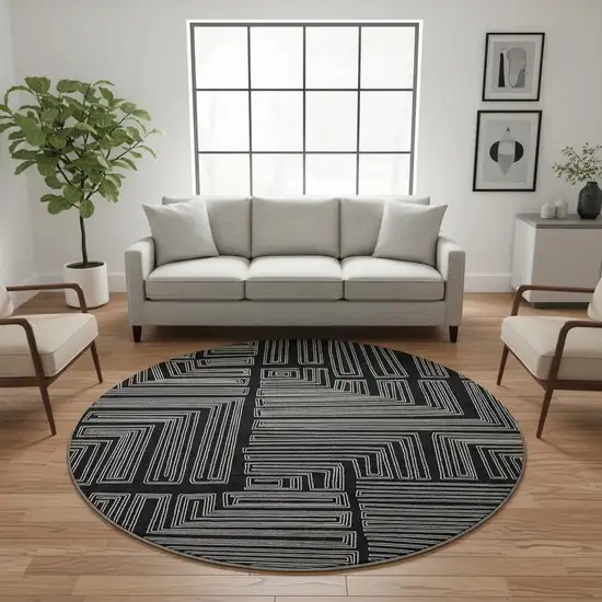 8' Black And Ivory Geometric Washable Round Rug With UV Protection Photo 2
