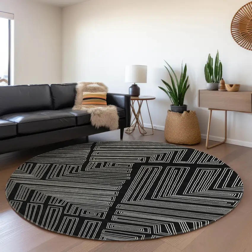 8' Black And Ivory Geometric Washable Round Rug With UV Protection Photo 4