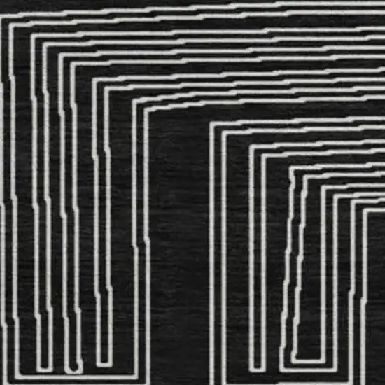 8' Black And Ivory Geometric Washable Round Rug With UV Protection Photo 3