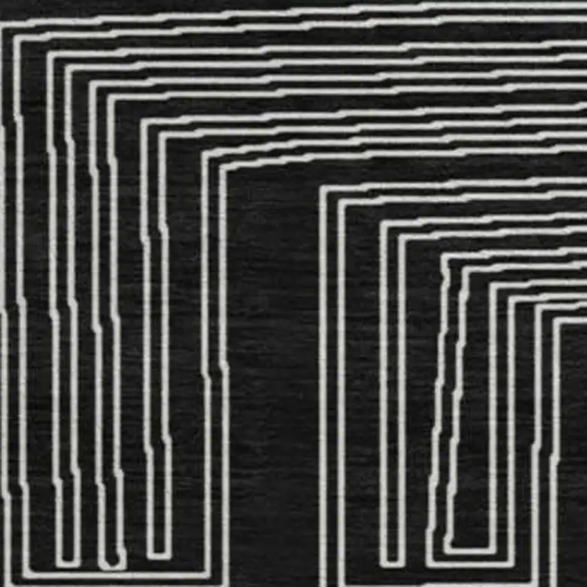 8' Black And Ivory Geometric Washable Round Rug With UV Protection Photo 3