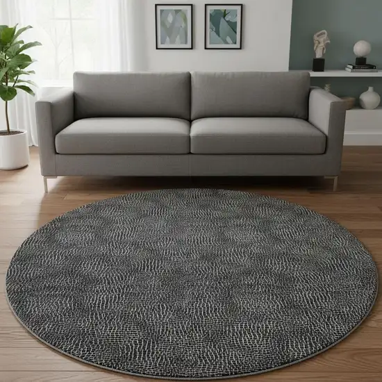 8' Black And Ivory Geometric Washable Round Rug With UV Protection Photo 2