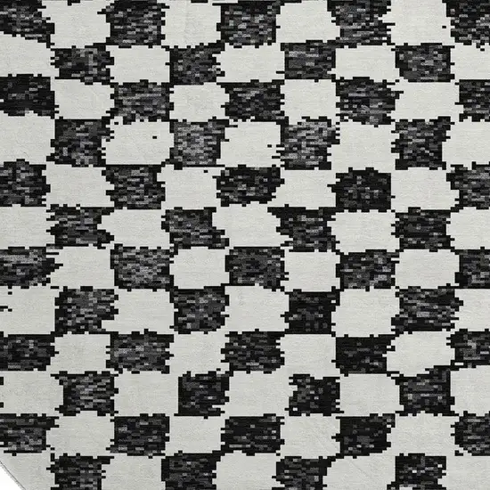 8' Black And Ivory Geometric Washable Round Rug With UV Protection Photo 3