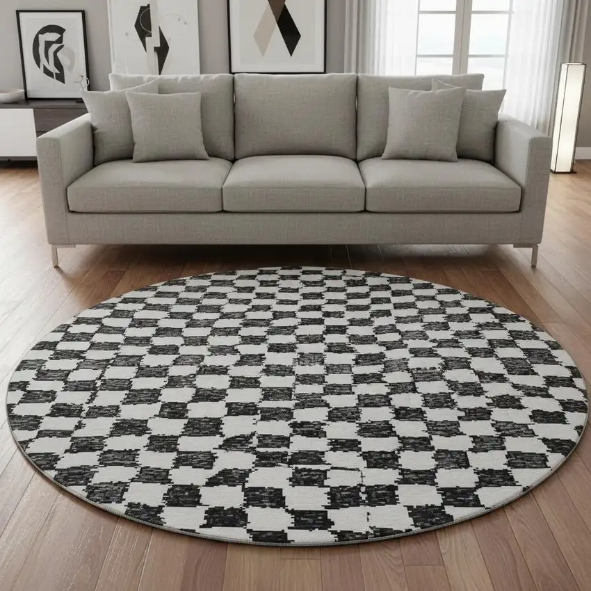 8' Black And Ivory Geometric Washable Round Rug With UV Protection Photo 2