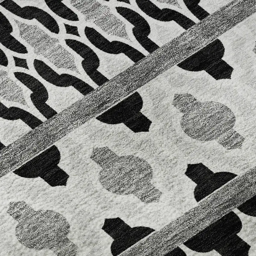 8' Black And Ivory Ikat Washable Round Rug With UV Protection Photo 9