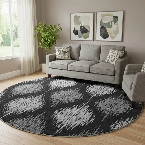 8' Black And Ivory Ikat Washable Round Rug With UV Protection Photo 1