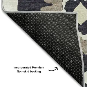 Photo of 8' Black And Ivory Medallion Washable Round Rug With UV Protection