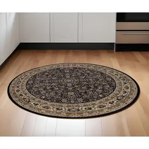 Photo of 6' Black And Ivory Oriental Round Rug