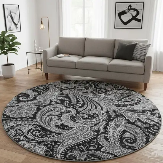8' Black And Ivory Paisley Washable Round Rug With UV Protection Photo 2