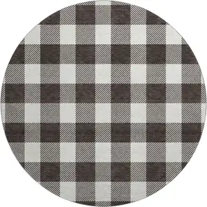 Photo of 8' Black And Ivory Plaid Washable Round Rug With UV Protection
