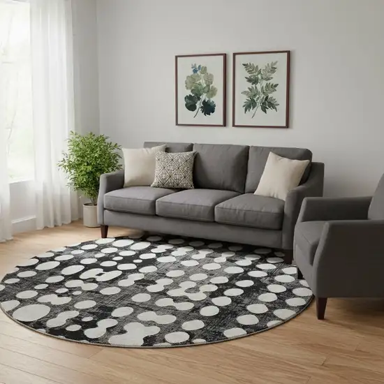 8' Black And Ivory Polka Dot Washable Round Rug With UV Protection Photo 1