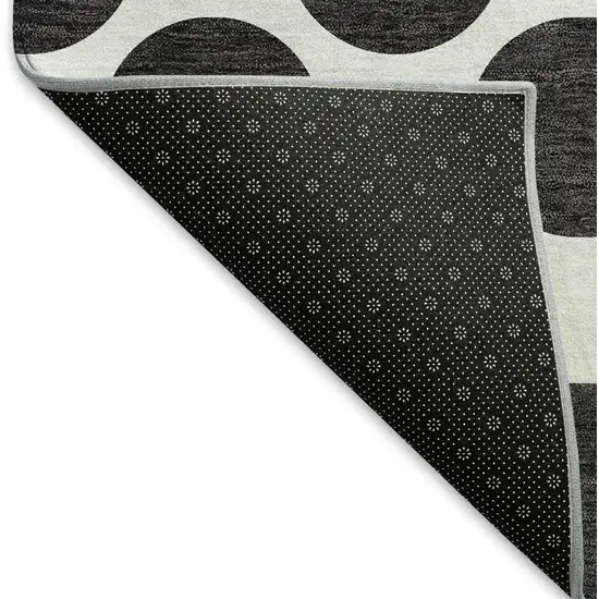 8' Black And Ivory Polka Dot Washable Round Rug With UV Protection Photo 5
