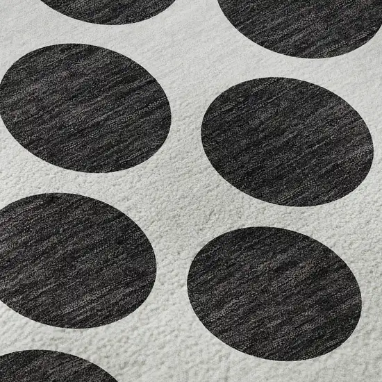 8' Black And Ivory Polka Dot Washable Round Rug With UV Protection Photo 8