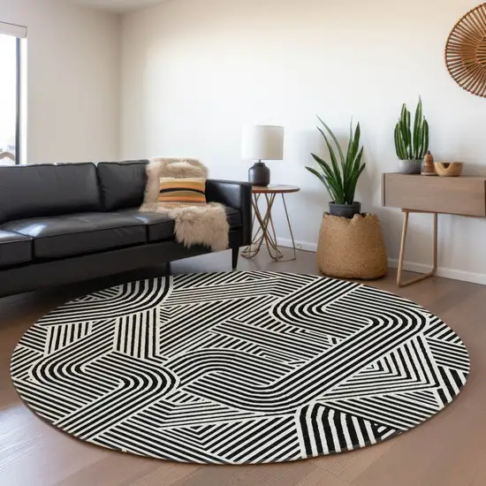 8' Black And Ivory Round Abstract Washable Indoor Outdoor Area Rug Photo 7