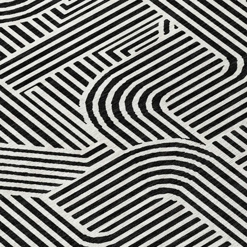 8' Black And Ivory Round Abstract Washable Indoor Outdoor Area Rug Photo 8