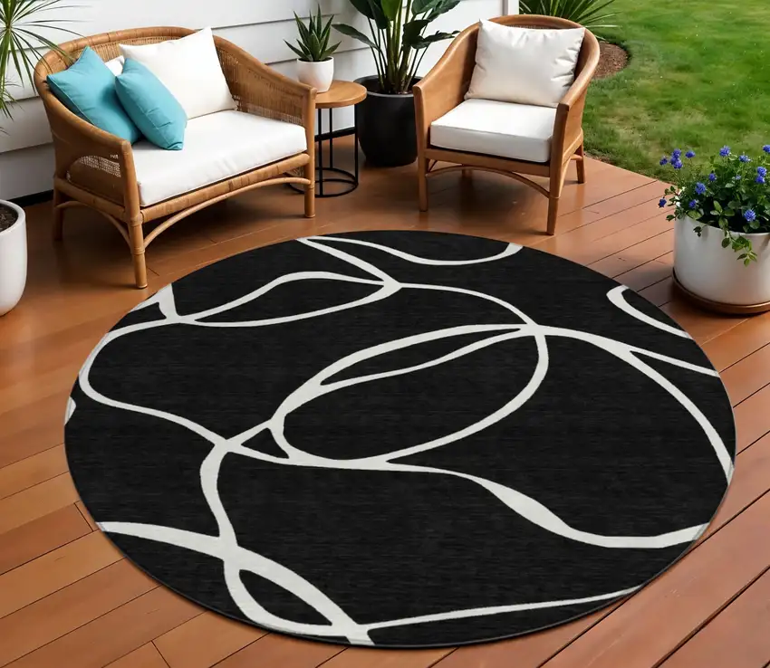 8' Black And Ivory Round Abstract Washable Indoor Outdoor Area Rug Photo 1