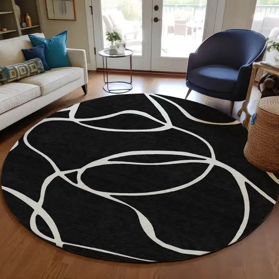 8' Black And Ivory Round Abstract Washable Indoor Outdoor Area Rug Photo 7