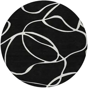 Photo of 8' Black And Ivory Round Abstract Washable Indoor Outdoor Area Rug