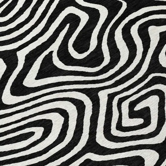 8' Black And Ivory Round Abstract Washable Indoor Outdoor Area Rug Photo 8