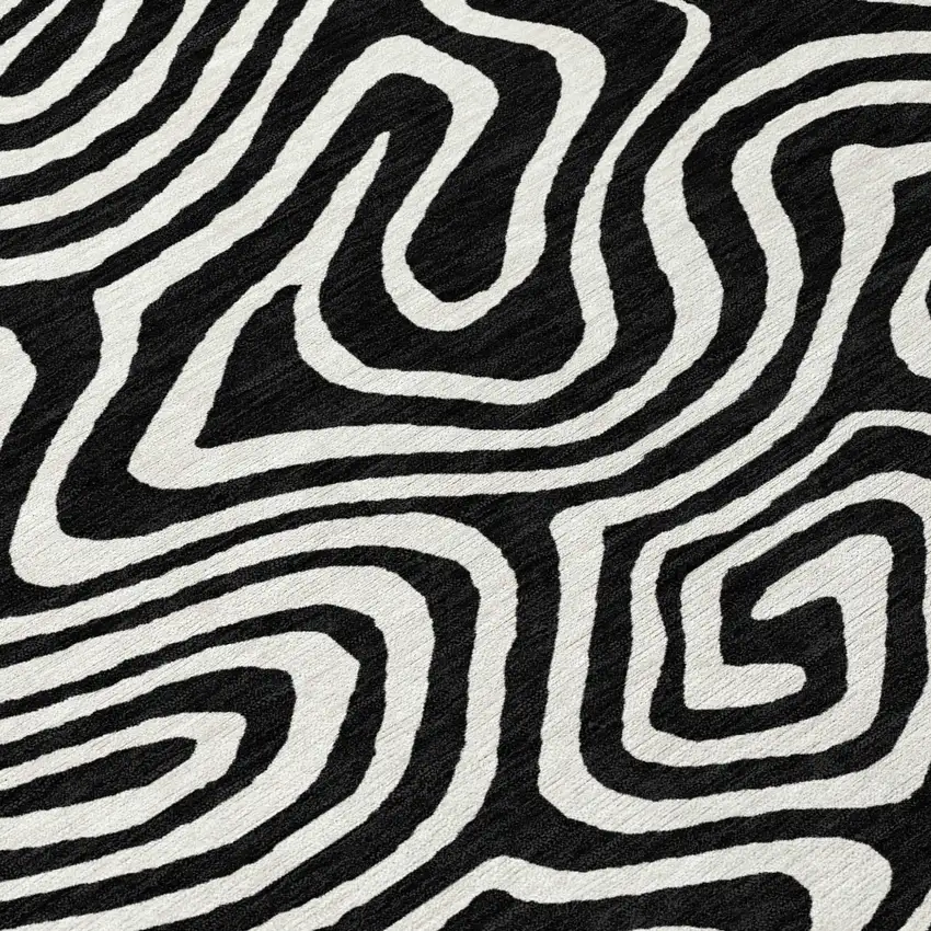 8' Black And Ivory Round Abstract Washable Indoor Outdoor Area Rug Photo 8