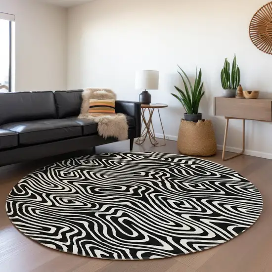 8' Black And Ivory Round Abstract Washable Indoor Outdoor Area Rug Photo 7
