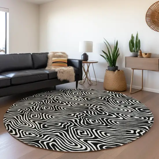 8' Black And Ivory Round Abstract Washable Indoor Outdoor Area Rug Photo 7