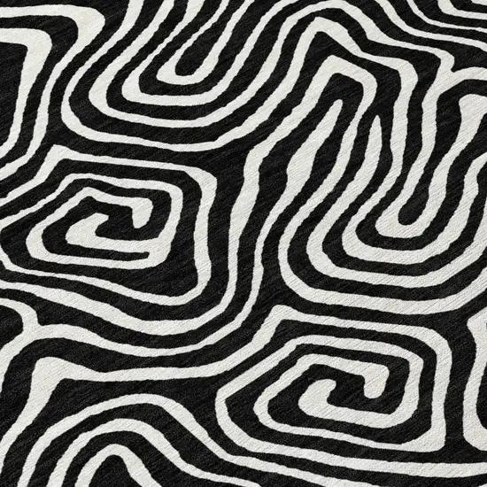 8' Black And Ivory Round Abstract Washable Indoor Outdoor Area Rug Photo 8