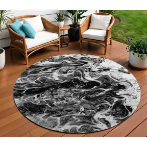 Photo of 8' Black And Ivory Round Abstract Washable Indoor Outdoor Area Rug