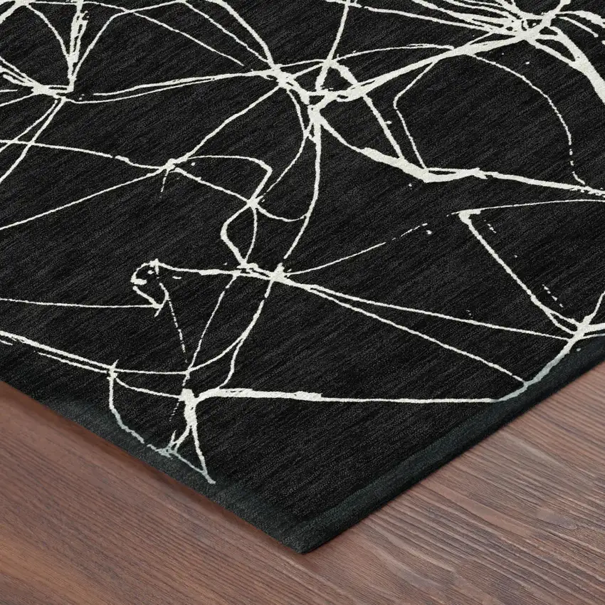 8' Black And Ivory Round Abstract Washable Indoor Outdoor Area Rug Photo 4