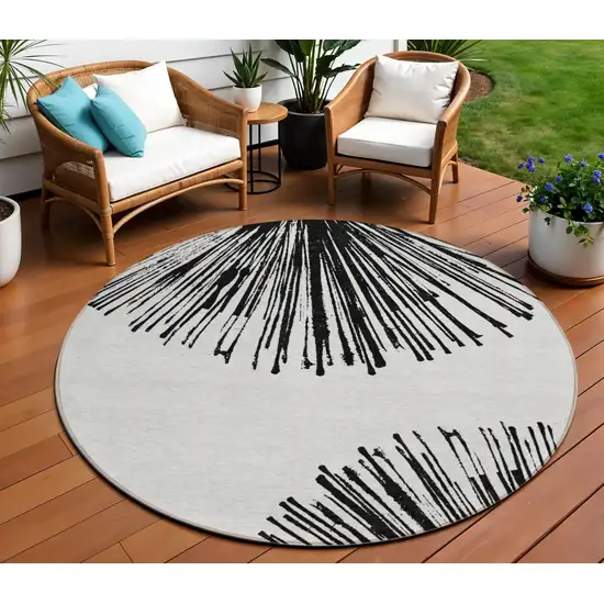 8' Black And Ivory Round Abstract Washable Indoor Outdoor Area Rug Photo 1
