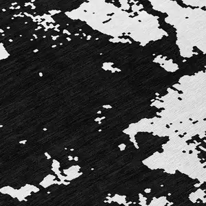 Photo of 8' Black And Ivory Round Abstract Washable Indoor Outdoor Area Rug